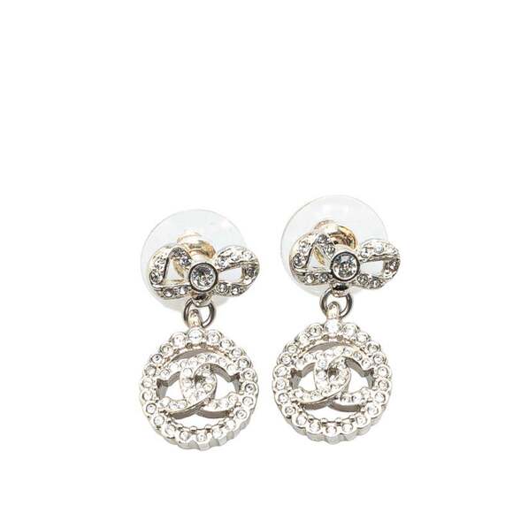 CHANEL Coco Mark Ribbon Motif Rhinestone Stud Earrings in Silver Metal for Women